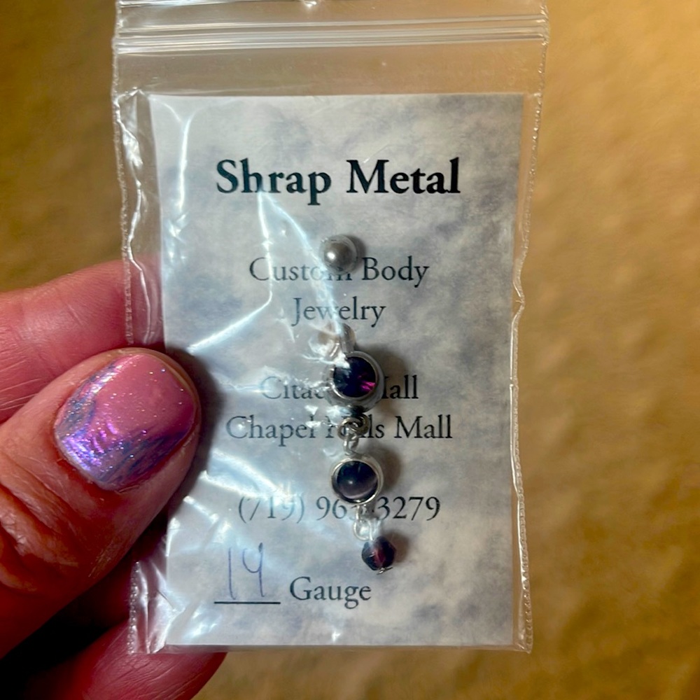 Super cute amethyst belly button ring.